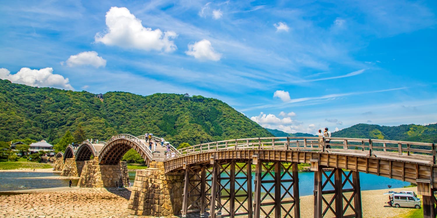 Kintaikyo Bridge in yamaguchi, Japan - Iconic five-arched wooden bridge spanning Nishiki River, renowned for its graceful curves and engineering dating from 1673.