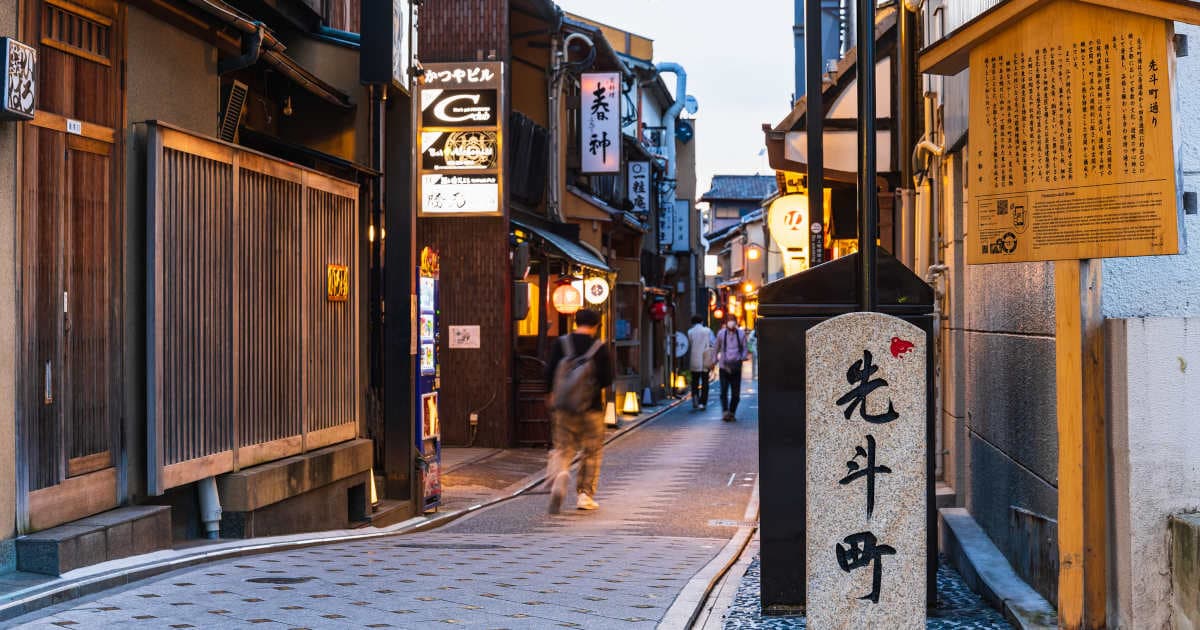 Pontocho Alley in kyoto, Japan - Atmospheric narrow alley lined with traditional restaurants, tea houses, and bars offering riverside dining along the Kamo River.