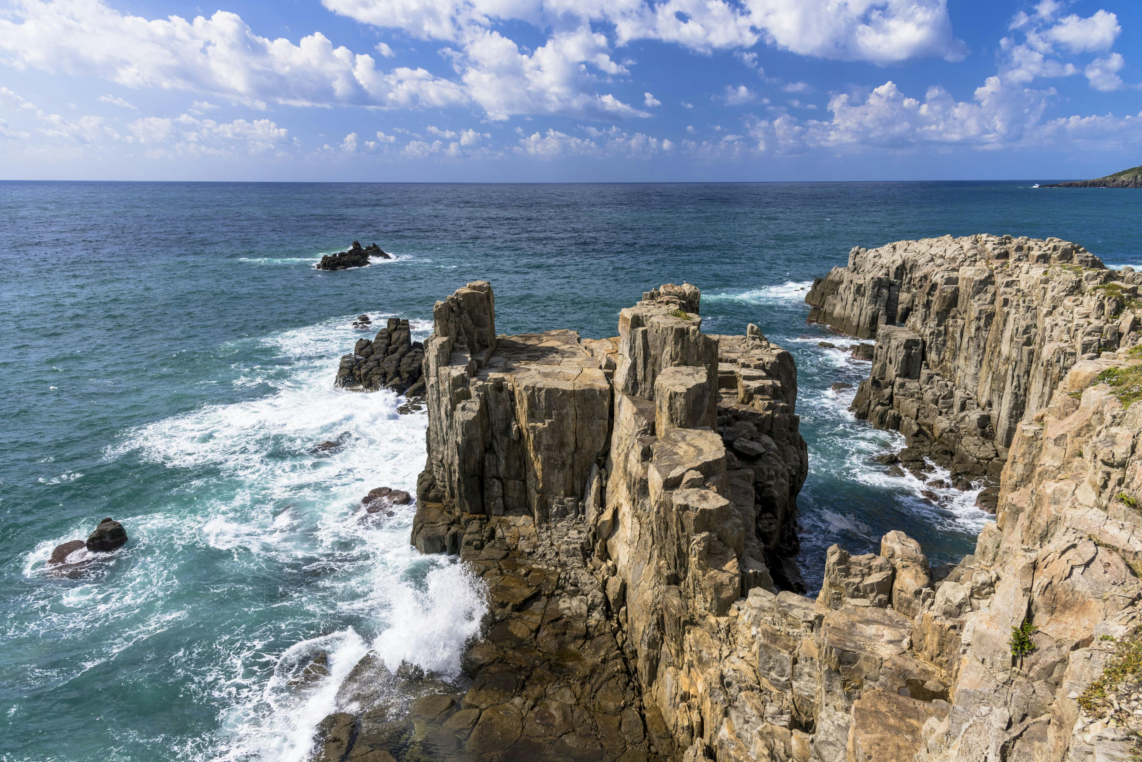 Tojinbo Cliffs in fukui, Japan - Dramatic columnar basalt cliffs rising from the Sea of Japan, formed by volcanic activity millions of years ago and designated as a Natural Monument for their unique geological formation.