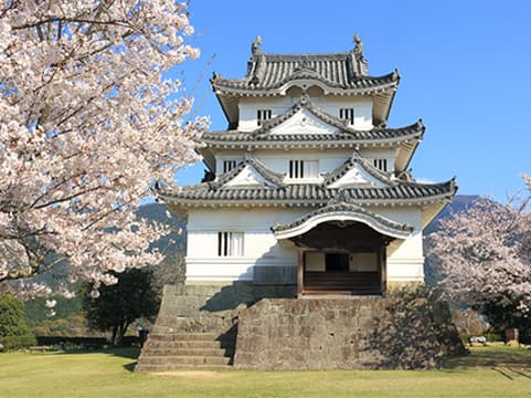 Uwajima Castle in ehime, Japan - One of twelve original castles in Japan, perched on a forested hill with a small but beautifully preserved Edo-period keep and coastal town views.
