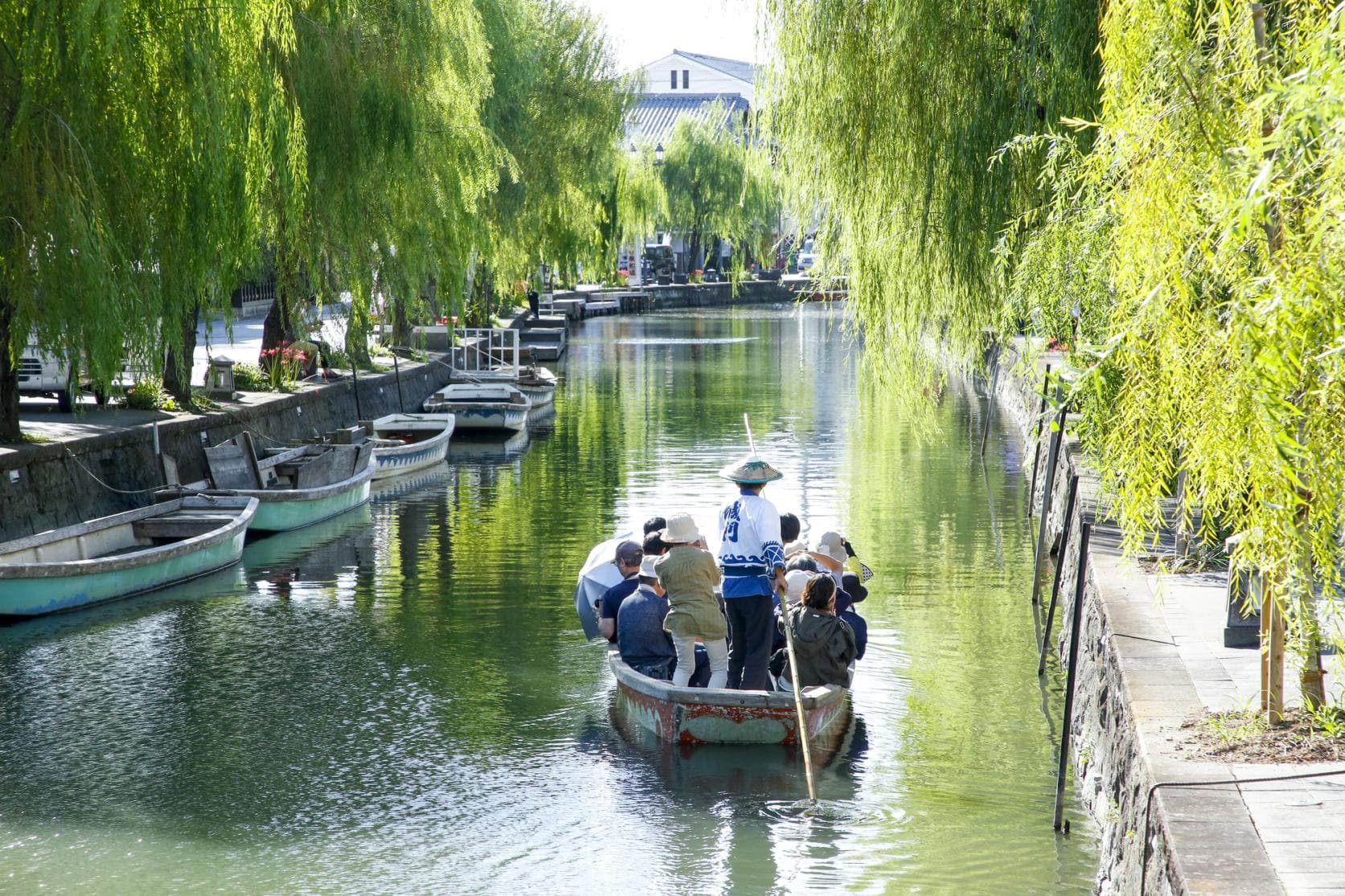 Yanagawa Canals in fukuoka, Japan - Historic canal town offering traditional wooden boat cruises through 930km of waterways lined with willow trees, samurai residences, and stone bridges dating to the Edo period.