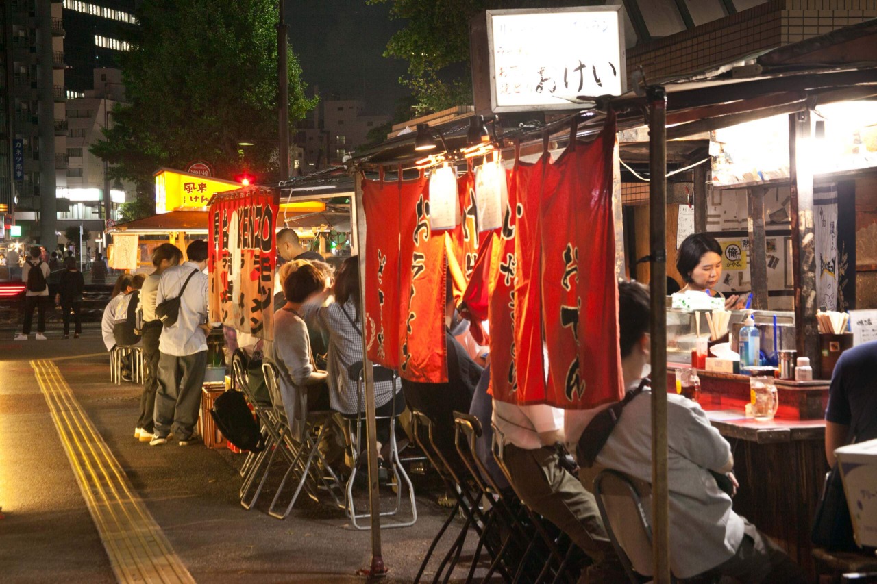 Hakata Yatai Food Stalls in fukuoka, Japan - Iconic open-air street food stalls that come alive at night, offering authentic Fukuoka cuisine and a unique social dining experience at communal counters.