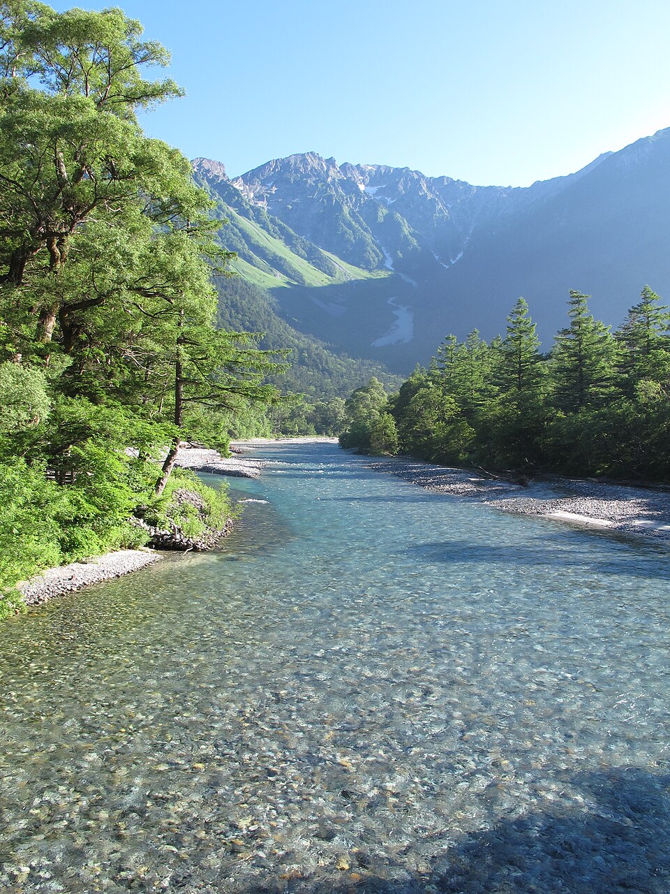 Kamikochi in nagano, Japan - A pristine mountain valley in the Northern Alps with crystal-clear rivers, ancient forests, and dramatic peaks. This protected national park area offers hiking trails and stunning natural beauty at 1,500 meters elevation.