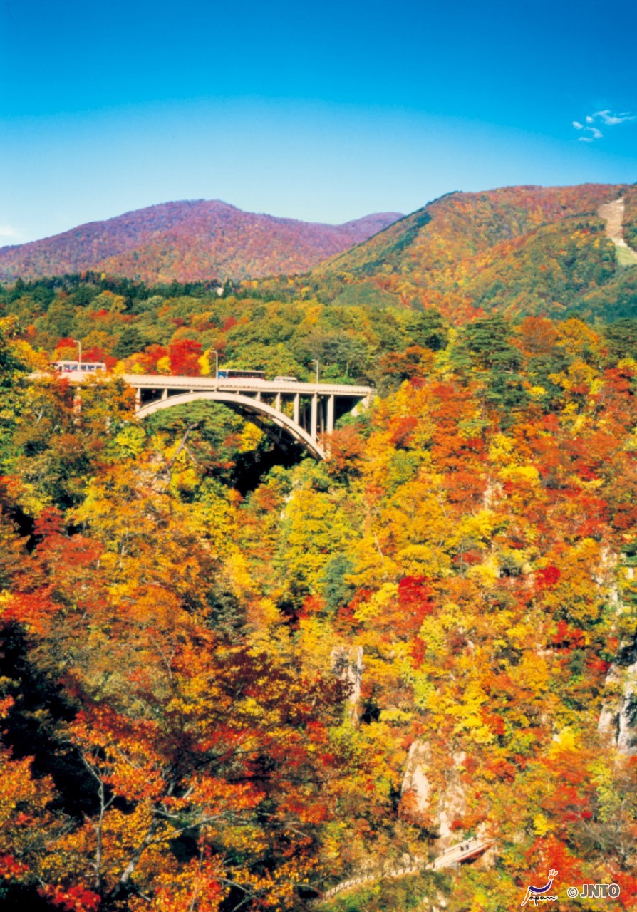 Naruko Gorge in miyagi, Japan - A dramatic 100-meter deep gorge carved by the Ohtani River, renowned as one of Tohoku's premier autumn foliage viewing destinations with vibrant red and gold landscapes.