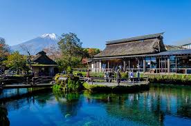 Oshino Hakkai in yamanashi, Japan - Eight crystal-clear spring-fed ponds formed by Mount Fuji's snowmelt, filtered through volcanic rock for decades. This picturesque village offers traditional thatched-roof houses and some of Japan's purest spring water with Mount Fuji as the backdrop.