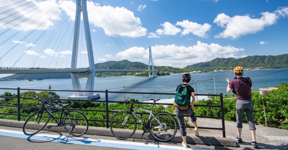 Shimanami Kaido Cycling Route in ehime, Japan - Japan's most scenic 70-kilometer cycling route crossing six islands via suspension bridges from Honshu to Shikoku over the Seto Inland Sea.